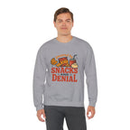 Crewneck Sweatshirt — "Powered by Snacks and Denial" Funny Snack Lover Pullover