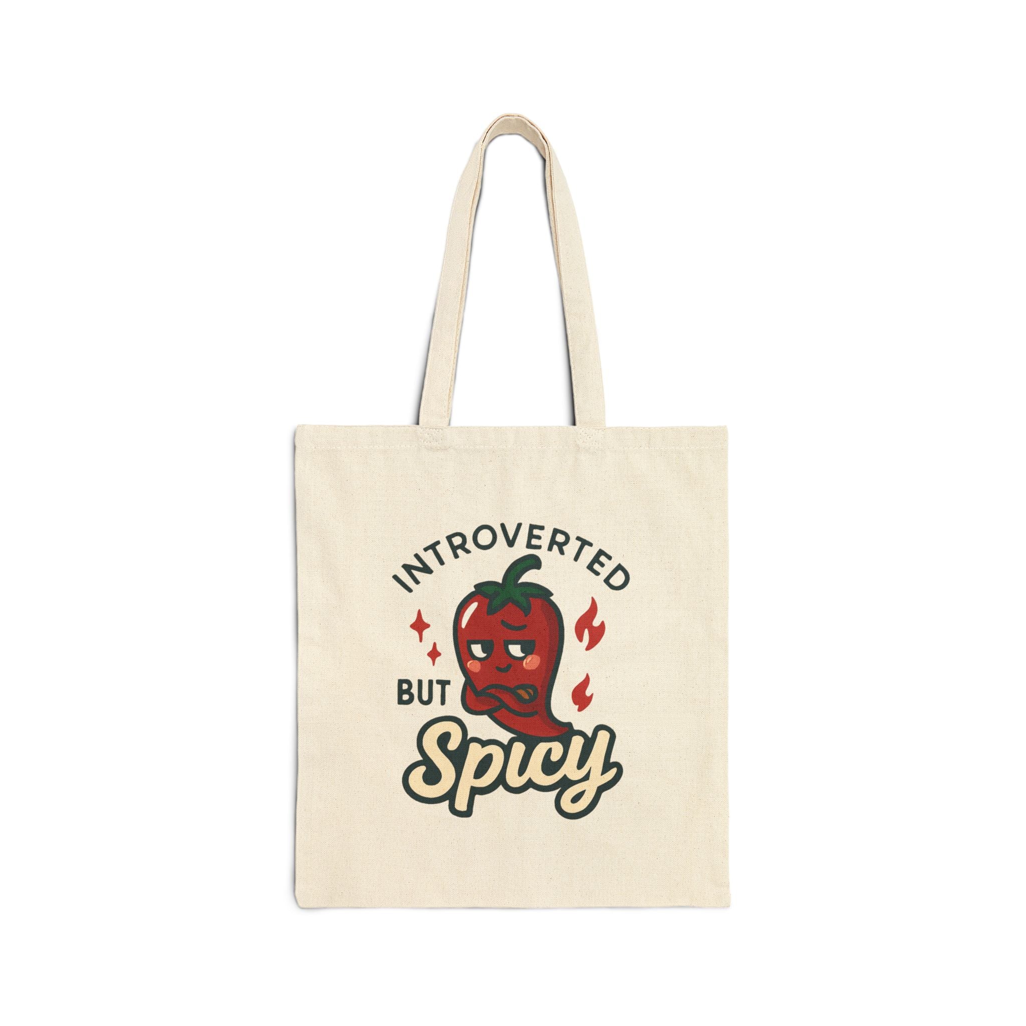 Introverted But Spicy cotton canvas tote bag with playful chili pepper design on natural fabric