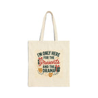 Natural cotton canvas tote bag with holiday-themed "I'm Only Here for the Presents and the Drama" print and long handles
