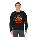 Crewneck Sweatshirt — "Powered by Snacks and Denial" Funny Snack Lover Pullover