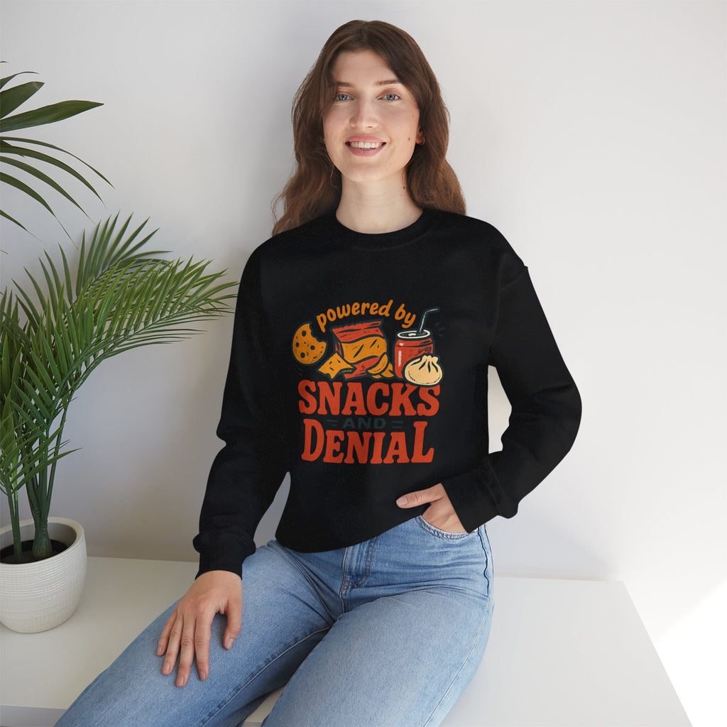 Crewneck Sweatshirt — "Powered by Snacks and Denial" Funny Snack Lover Pullover