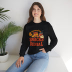 Crewneck Sweatshirt — "Powered by Snacks and Denial" Funny Snack Lover Pullover