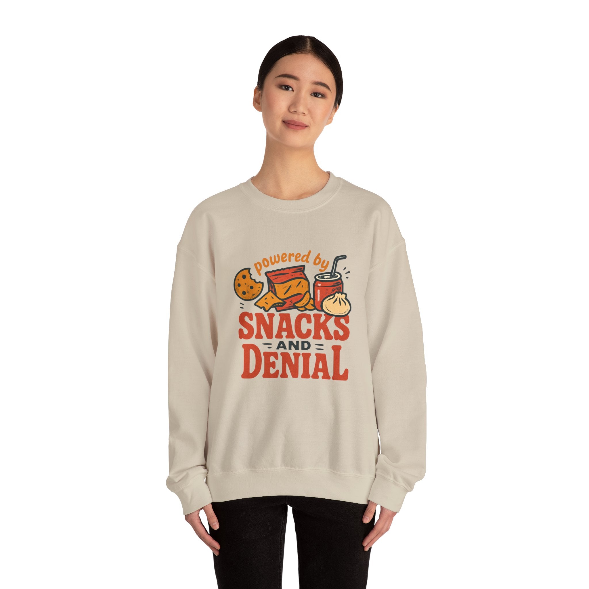 Crewneck Sweatshirt — "Powered by Snacks and Denial" Funny Snack Lover Pullover