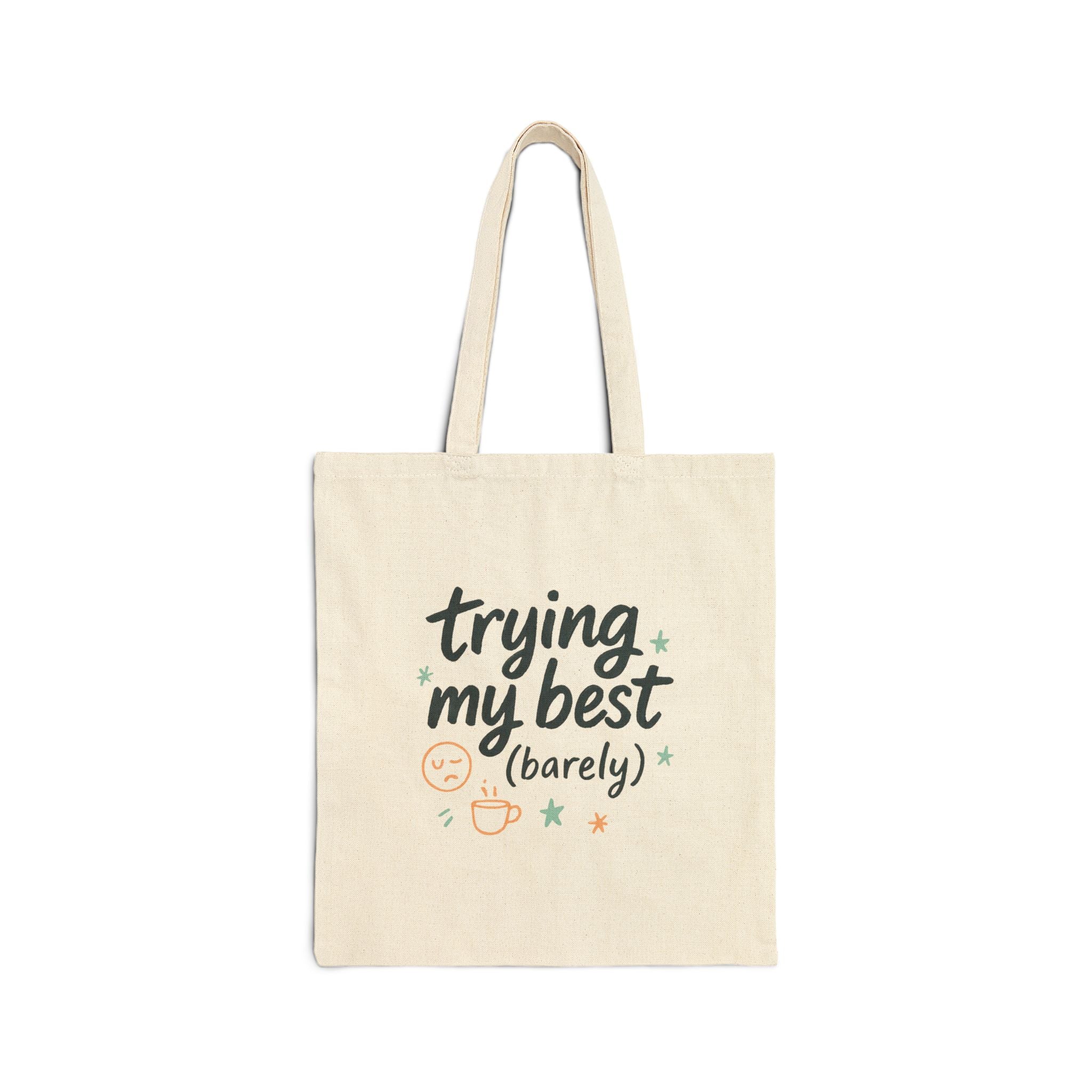 Natural cotton tote bag with "trying my best (barely)" printed in playful lettering and doodles, reusable shopper with sturdy handles.