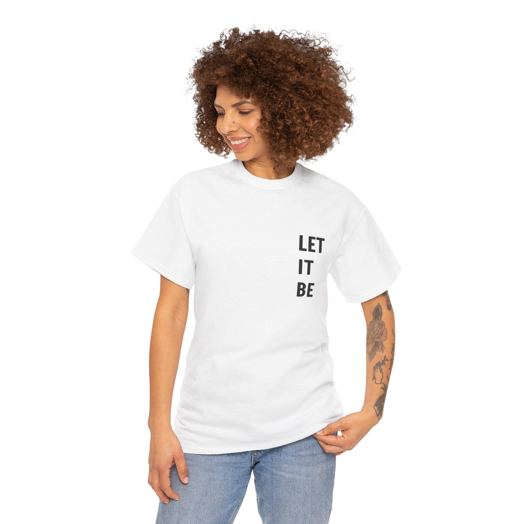 woman wearing white LET IT BE custom t shirts with black text and denim jeans