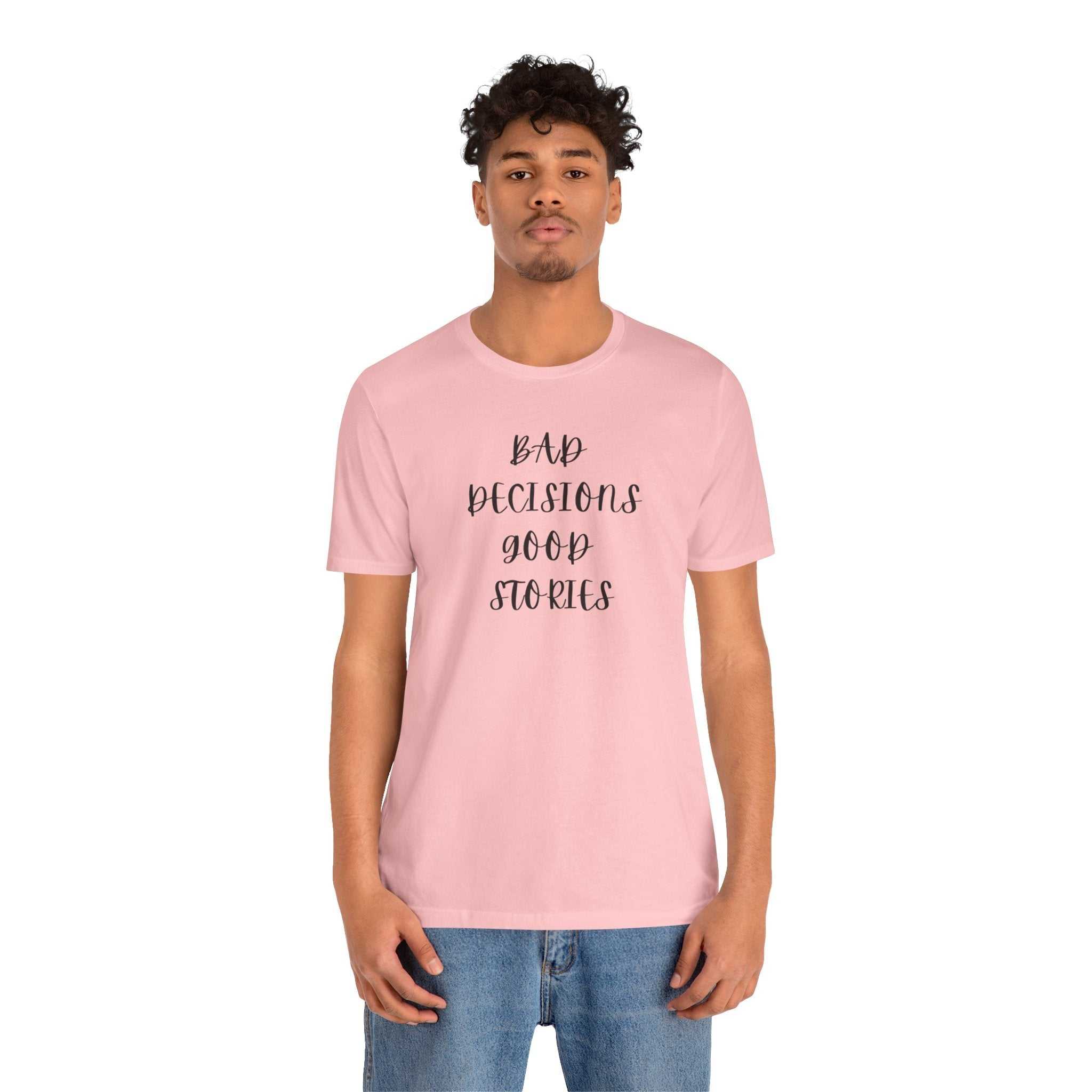 custom t shirts Man wearing pink BAD DECISIONS GOOD STORIES Tee with black text on front
