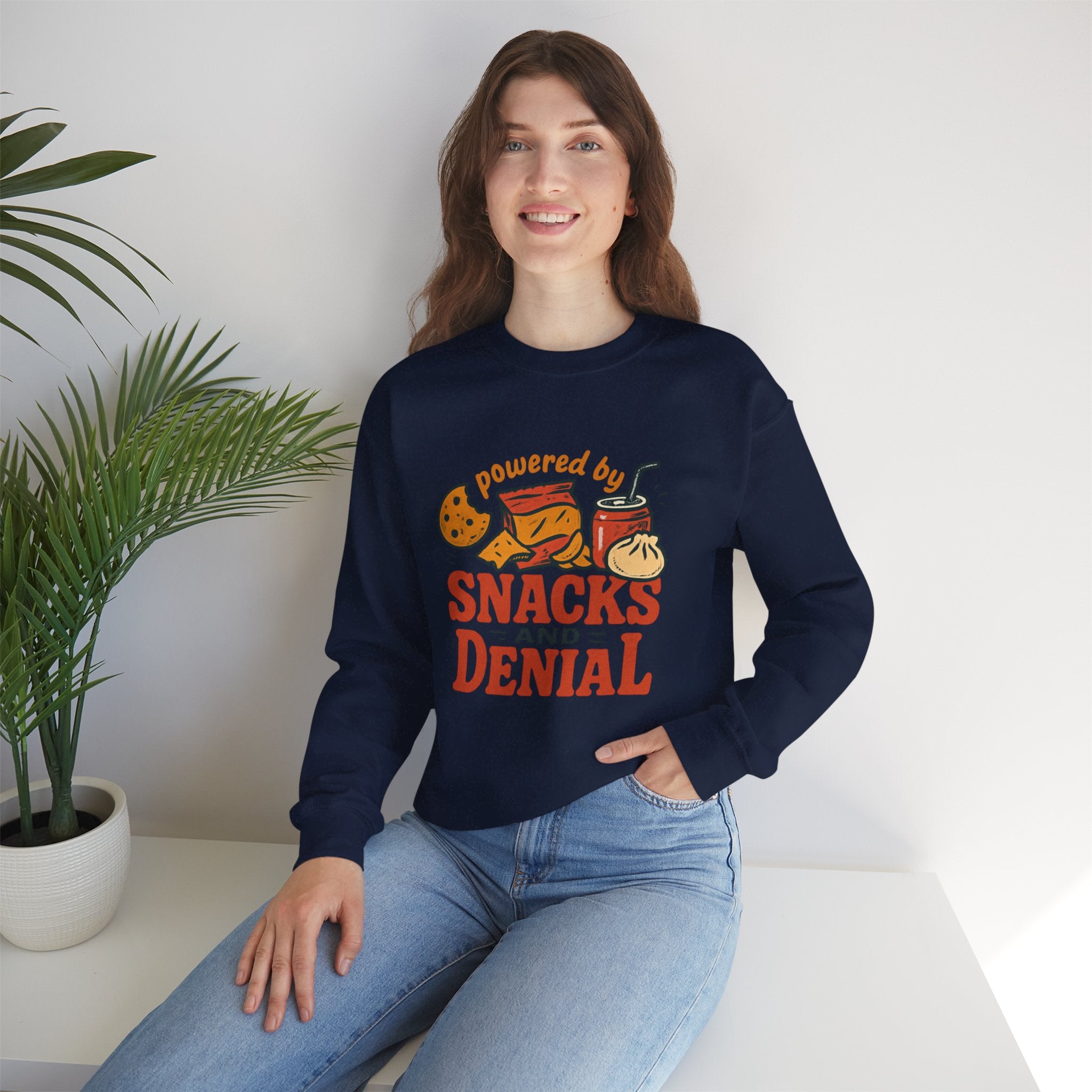Crewneck Sweatshirt — "Powered by Snacks and Denial" Funny Snack Lover Pullover