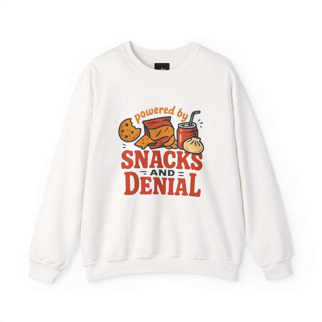 White crewneck sweatshirt with "powered by SNACKS AND DENIAL" graphic featuring chips, cookie, drink, and dumpling