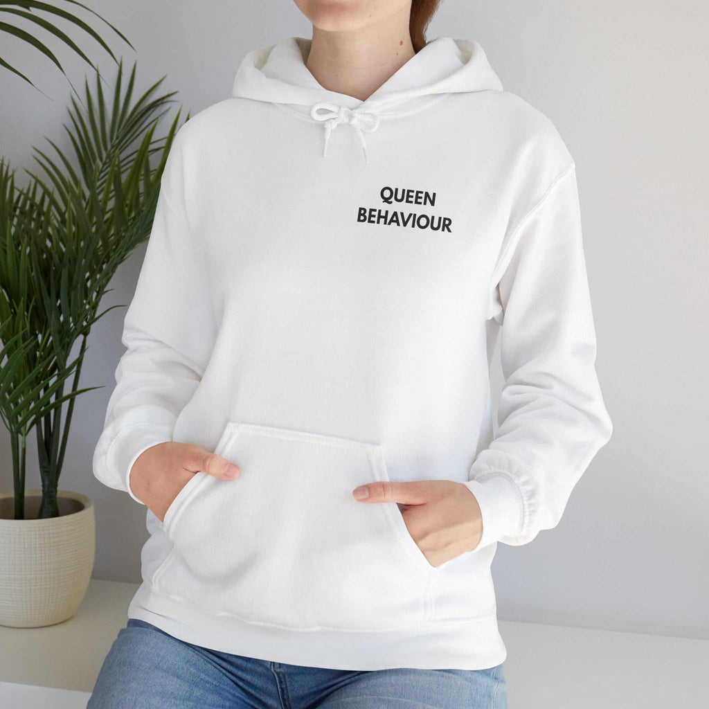 custom hoodies Woman wearing white Queen Behaviour Hoodie with minimal text chest print and kangaroo pocket